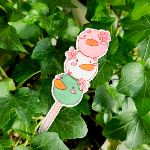 Cute Dango duck sticker with sakura flowers.