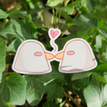 Two ducks kissing sticker