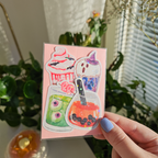 One pink sticker pack with 4 stickers inside. Halloween themed drinks. Sparkly picture.
