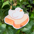 Cute white duck on a toast sticker