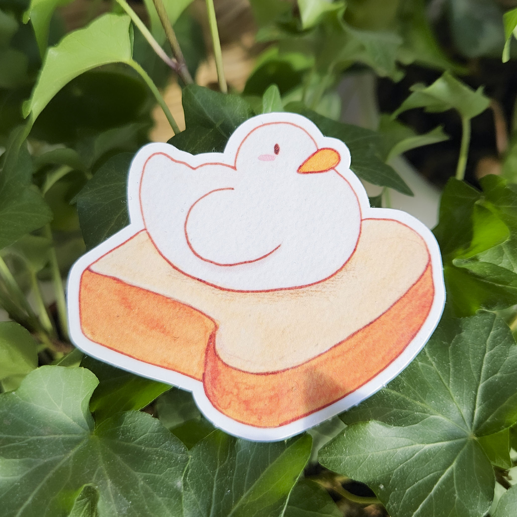 Cute white duck on a toast sticker